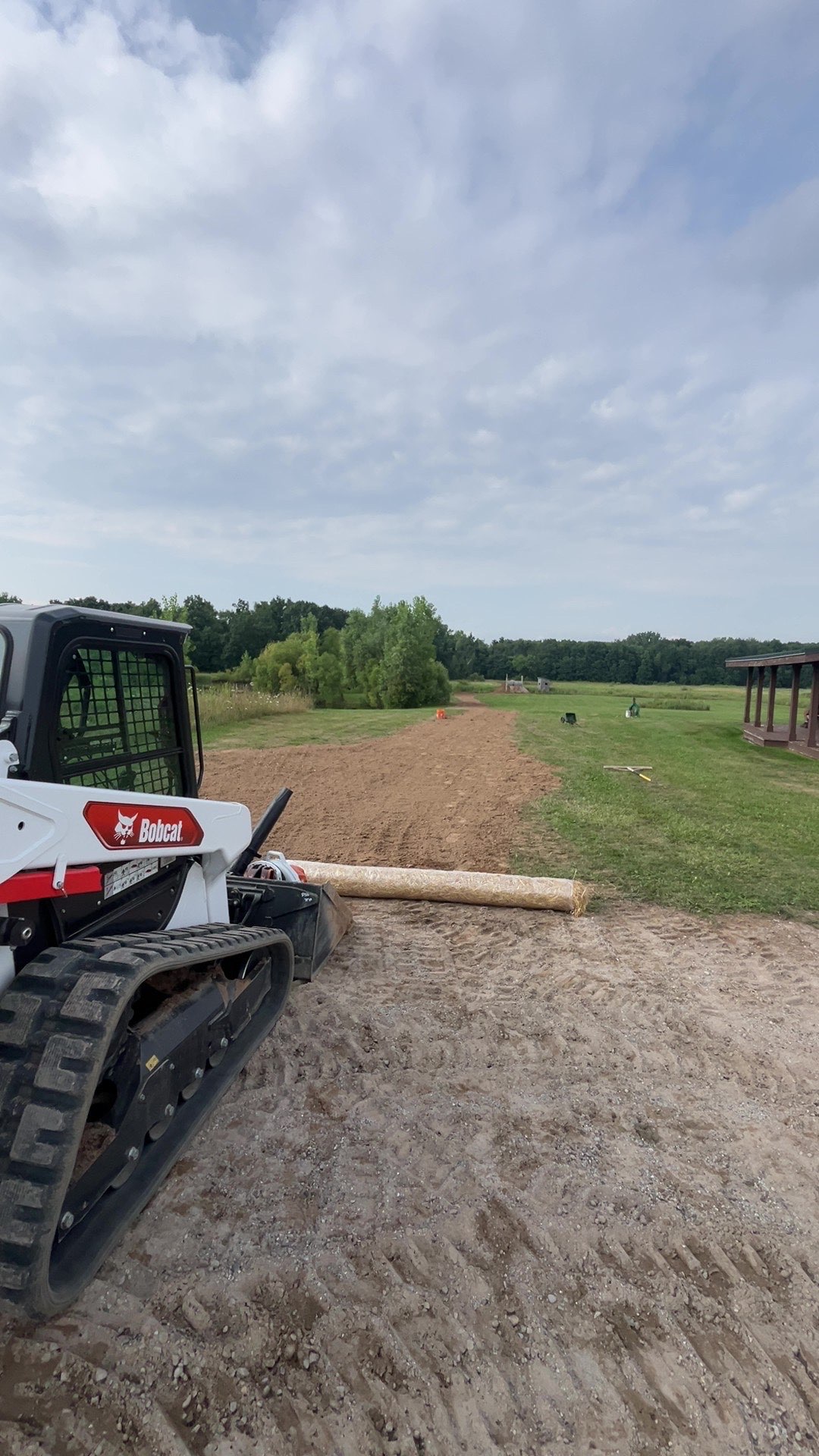 Retsok skid steer preparing and grading an outdoor work area