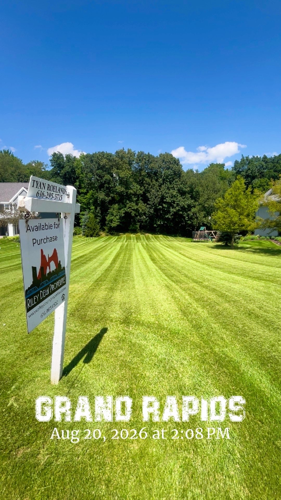 Bright green lawn with crisp professional mowing stripes